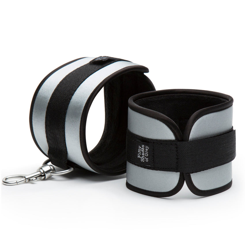 Close-up on the cuffs included with the Fifty Shades of Grey Bed Restraint Kit. The cuffs are fastened with a Velcro strap. | Kinkly Shop