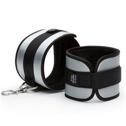 Close-up on the cuffs included with the Fifty Shades of Grey Bed Restraint Kit. The cuffs are fastened with a Velcro strap. | Kinkly Shop