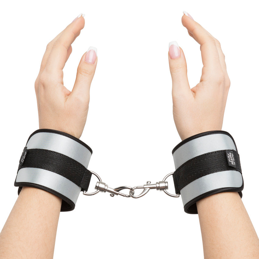 Two wrists encircled in the Fifty Shades of Grey Bed Restraint Kit which are bound together. This allows the cuffs to be used without the bed restraint kit to function as handcuffs. | Kinkly Shop
