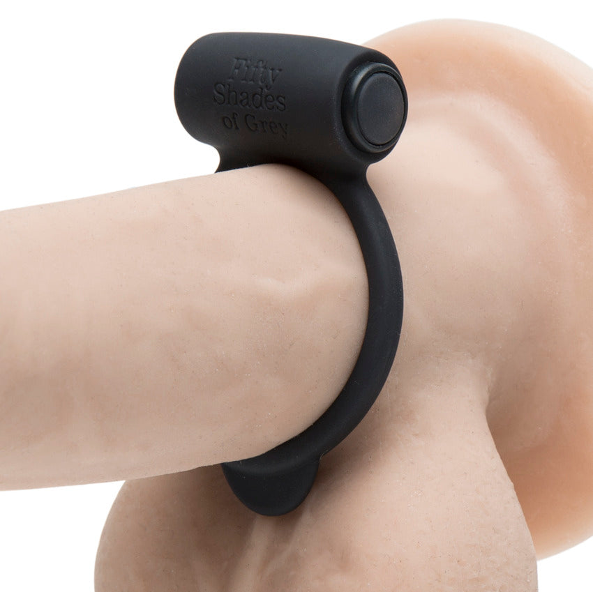 The Fifty Shades of Grey Yours and Mine ring is shown worn on the base of a realistic dildo. It is a very thin ring, taking up very little footprint space along the length of the dildo. | Kinkly Shop