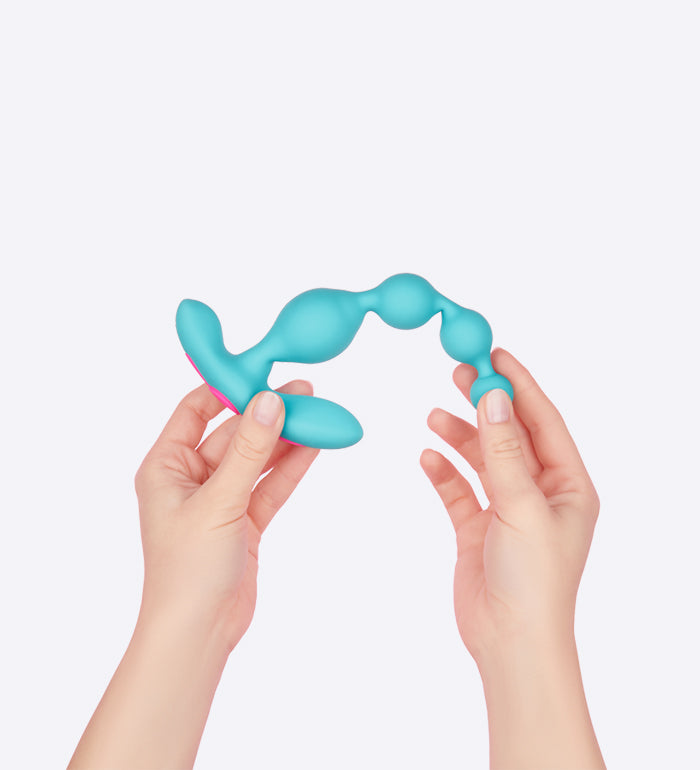Two hands hold opposite ends of the FemmeFunn Funn Beads. They bend the beads, showcasing how the space in-between each bead has a bit of flexibility to "bend" to it. | Kinkly Shop