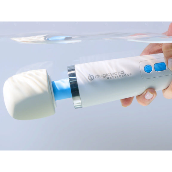 The Magic Wand Waterproof Rechargeable is held underwater, showcasing its waterproof capabilities | Kinkly