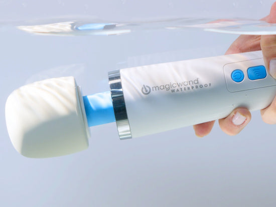 The Magic Wand Waterproof Rechargeable is held underwater, showcasing its waterproof capabilities | Kinkly