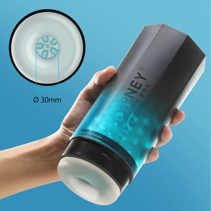 A hand holds the Adrian Rotator. The stroker is particularly large in the person's hand, and it looks like it might be more comfortable to grip with two hands. The inner diameter unstretched opening is 30mm in width. | Kinkly Shop