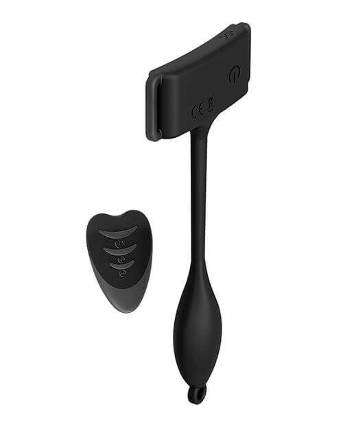 The Adrien Lastic Pan-T Vibrator shown up against a plain white background. It's shown without the harness, only showing the vibrator itself and the remote that controls the vibrator itself. The harness is not connected and is nowhere in sight. | Kinkly Shop