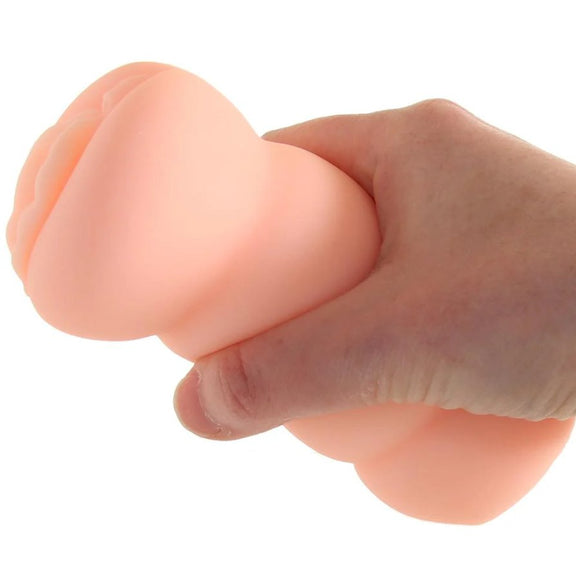 A hand is holding the AJ Applegate Pussy stroker. The stroker fits very comfortably into the hand, almost looking a bit small inside the person's hand. | Kinkly Shop