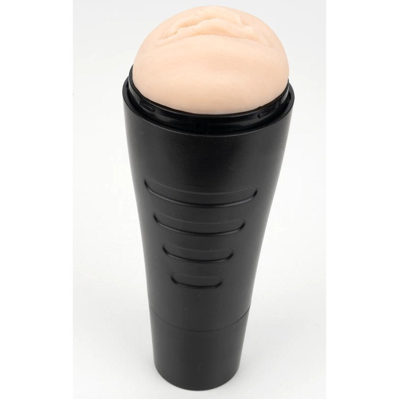 The Cousins Group Hard Case Pussy stroker in its case. The end cap is on the stroker, and the stroker is facing up towards the ceiling, showcasing how the stroker can sit upright when in the black plastic case. | Kinkly Shop