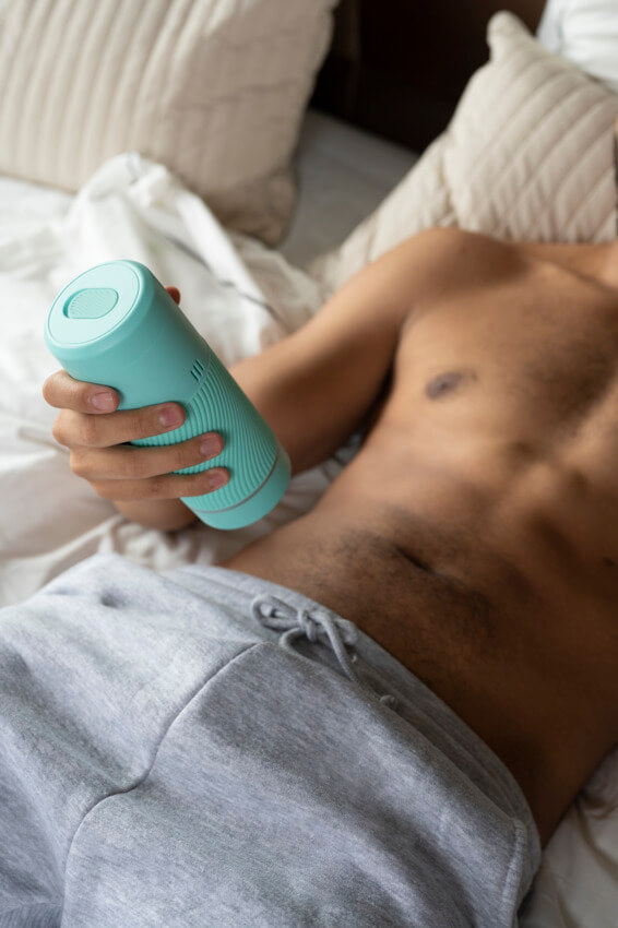 A person in grey sweatpants is holding the Arcwave Pow. | Kinkly Shop