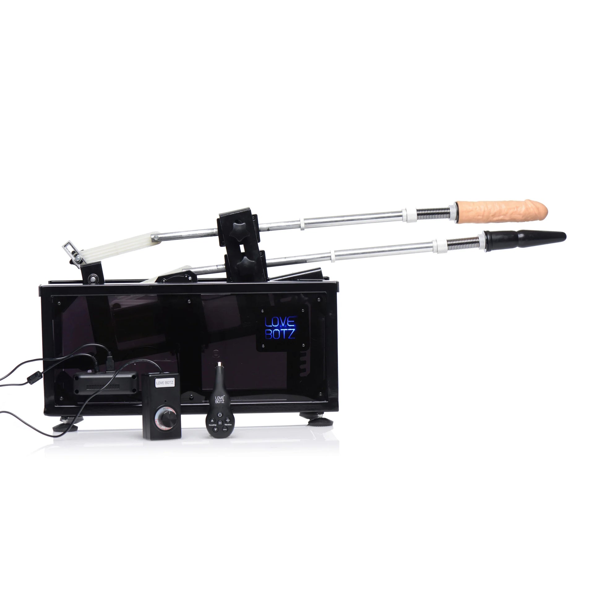 Side view of the Athena's Ultimate Sex Machine showcases two toys attached to the sex machine in addition to the remotes in front of the box of the machine. | Kinkly Shop