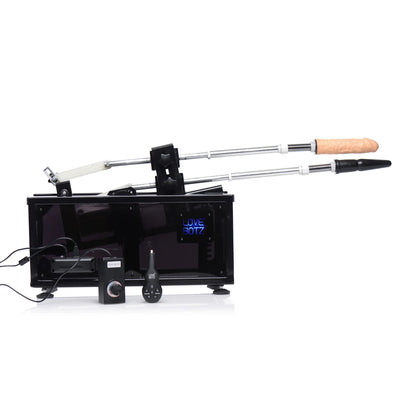Side view of the Athena's Ultimate Sex Machine showcases two toys attached to the sex machine in addition to the remotes in front of the box of the machine. | Kinkly Shop