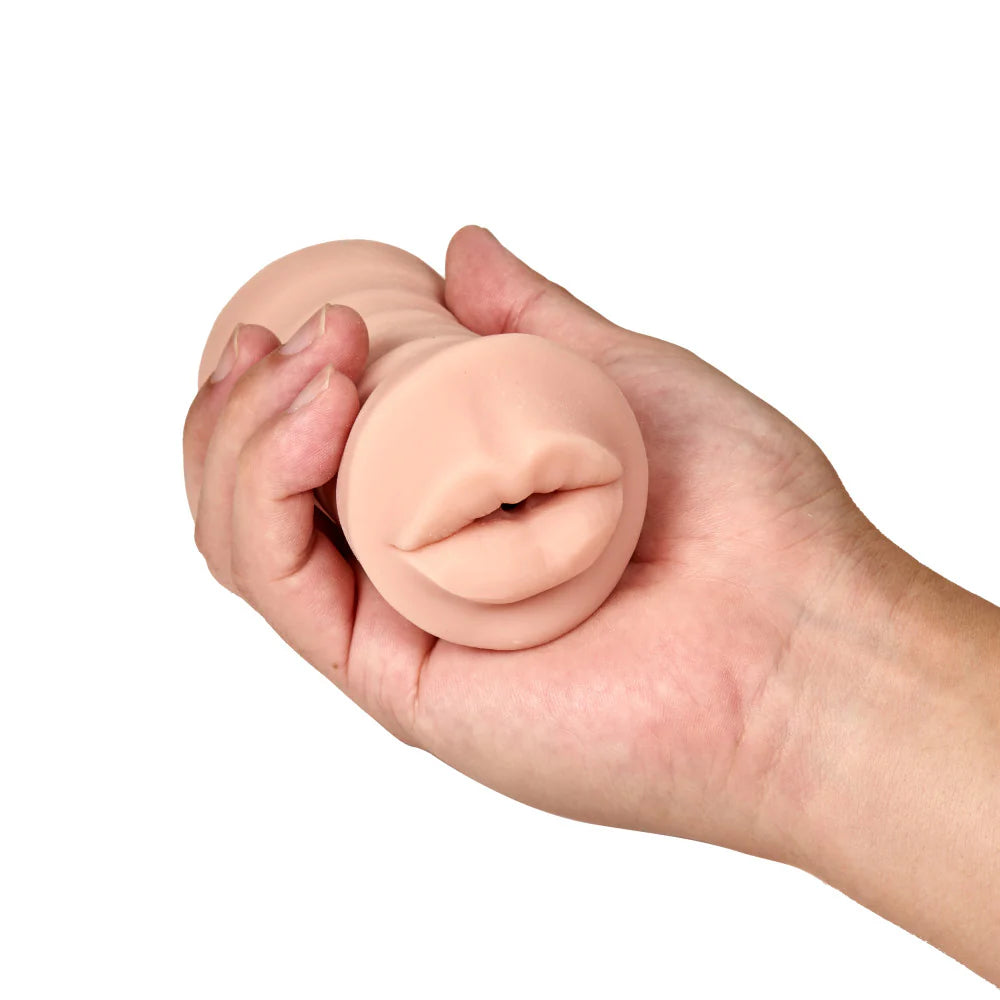A hand holds the Angie with Vibrator. The stroker looks small and easy to grip with one hand. | Kinkly Shop