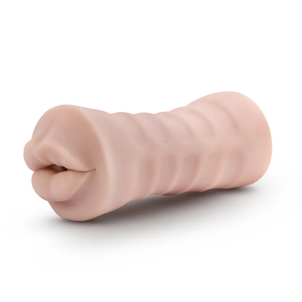 Side view of the Angie with Vibrator. This showcases the textured exterior of the stroker that makes it easier to hold. | Kinkly Shop