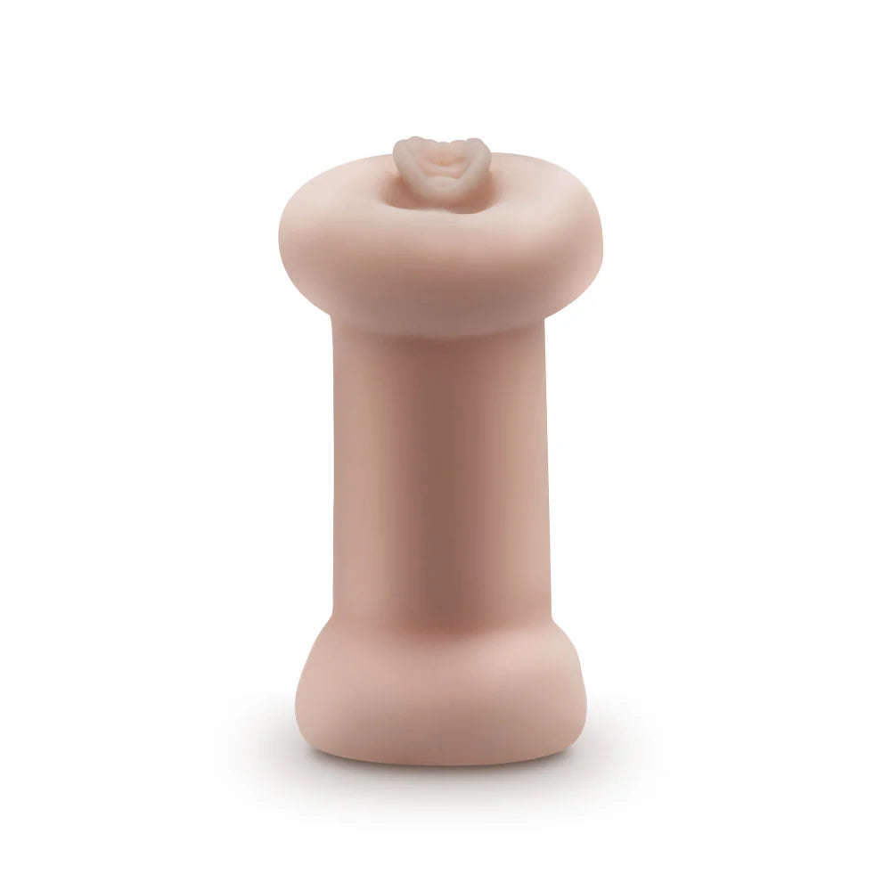 A side view of the Blush Double Trouble Glow in the Dark. The stroker's two orifices have flares to them to make the stroker easier to grip | Kinkly