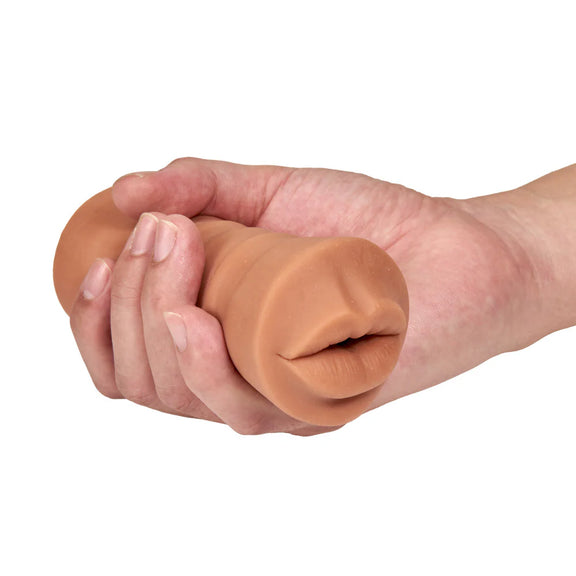 A hand holds the Isabella Mocha with Vibrator. The stroker looks particularly slim and easy to grip. | Kinkly Shop