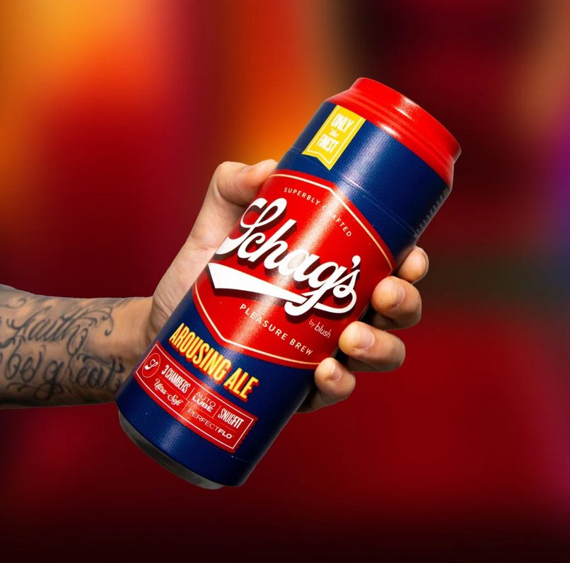 A hand holds the Blush Schag's Beer Stroker case. The lid is still on the stroker, and it looks like a large beer can that someone is about to drink. | Kinkly Shop