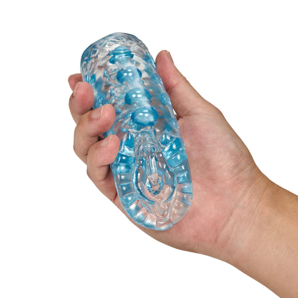 A hand is holding the Blush Super Stroker. The stroker is relatively short, about the length of the palm, and it looks like it's comfortable to grip. | Kinkly Shop