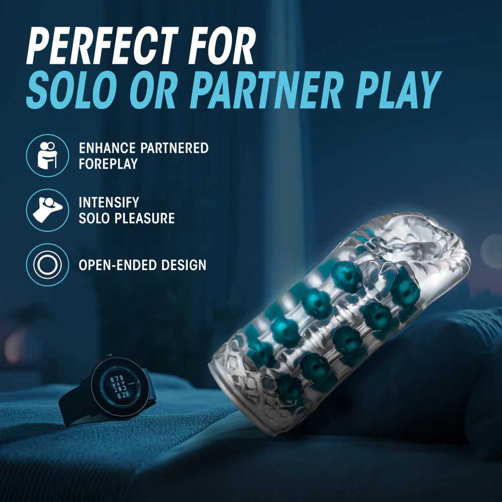 The Blush Super Stroker lays out on a bed cushion. Text on the image reads: Perfect for solo or partner play. Enhance partnered foreplay. Intensify solo pleasure. Open-ended design. | Kinkly Shop