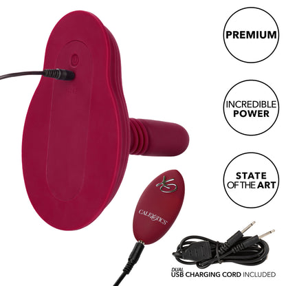 Close-up on the base of the Dual Rider Thrust and Grind shows the vibrator and remote plugged in to charge. Both are rechargeable. Text on the image reads: Premium, incredible power, state of the art, dual USB charging cord included. Looks like you can charge both the remote and the toy at once. | Kinkly