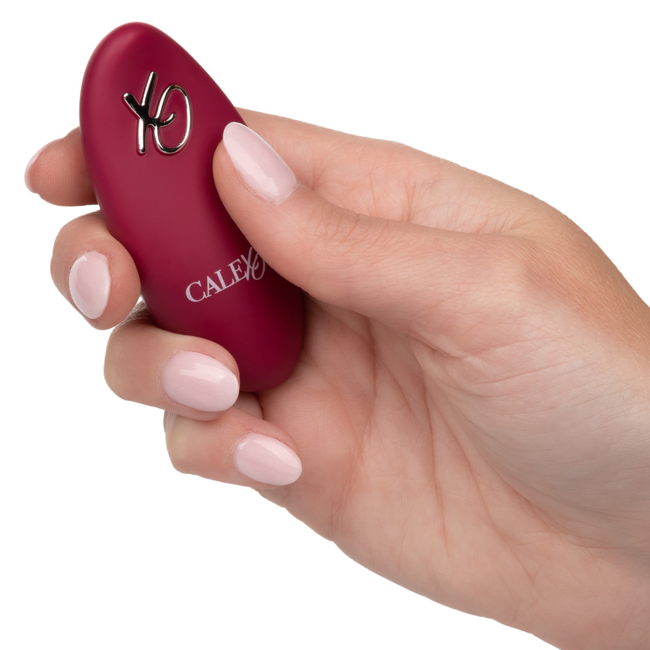 A hand holds the Dual Rider Thrust and Grind. The remote is oval shaped and relatively small | Kinkly