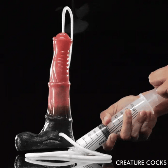 GIF shows a person pushing cum lube through a syringe. It squirts out the top of the Creature Cocks Squirting Centaur | Kinkly Shop
