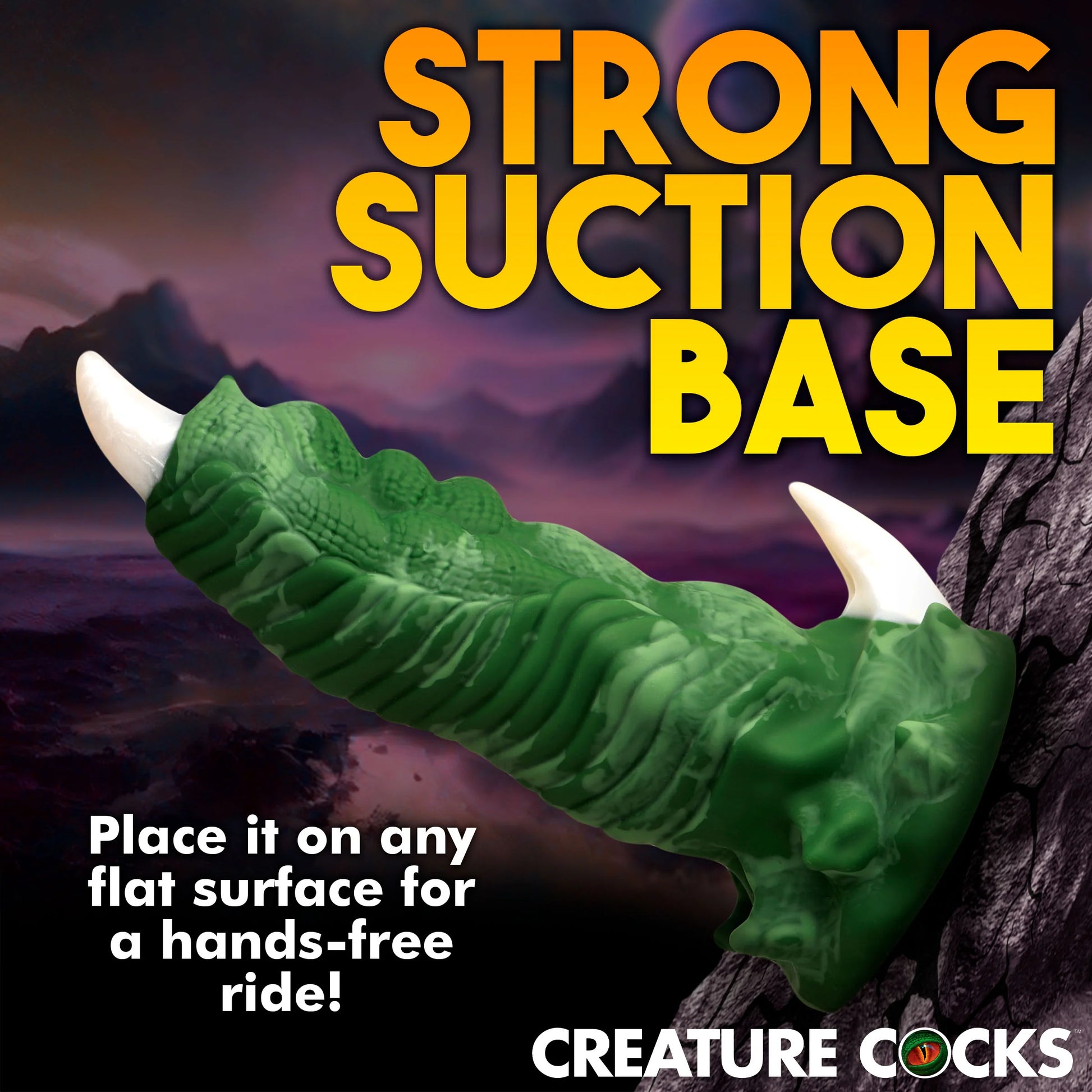 The Creature Cocks Dragon Claw is shown suction cupped to a cracked rock. Text on the image reads: Strong suction base. Place it on any flat surface for a hands-free ride. | Kinkly Shop