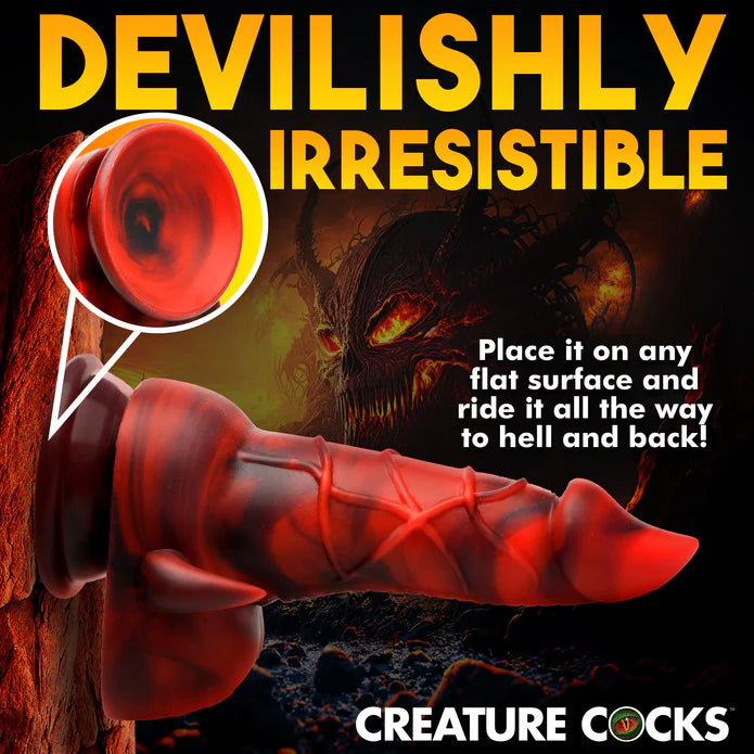 The Creature Cocks Horny Devil shown suction cupped up to a volcanic wall. Text on the image reads: "Devilish irresistible. Place it on any flat surface and ride it all the way to hell and back."  | Kinkly Shop