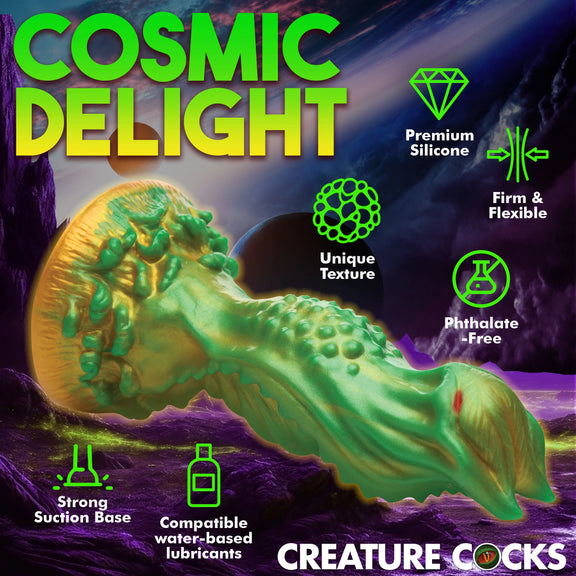 The Creature Cocks Nebula with icons and text surrounding it that explain the features. Text includes: "premium silicone, unique texture, firm and flexible, phthalate-free, strong suction base, compatible with water-based lubricants" | Kinkly Shop
