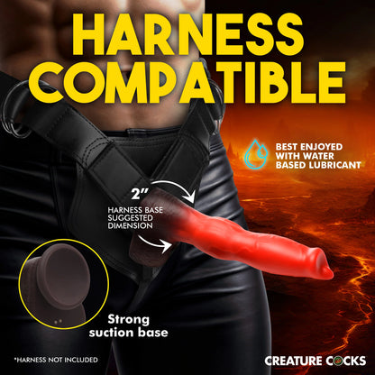 A person is wearing the Creature Cocks Ramming Hound with Remote Control in a heavy-duty strap on harness. Text reads: Harness compatible. 2" harness base suggested dimension. Strong suction base. Harness not included. Best enjoyed with water-based lube. | Kinkly Shop