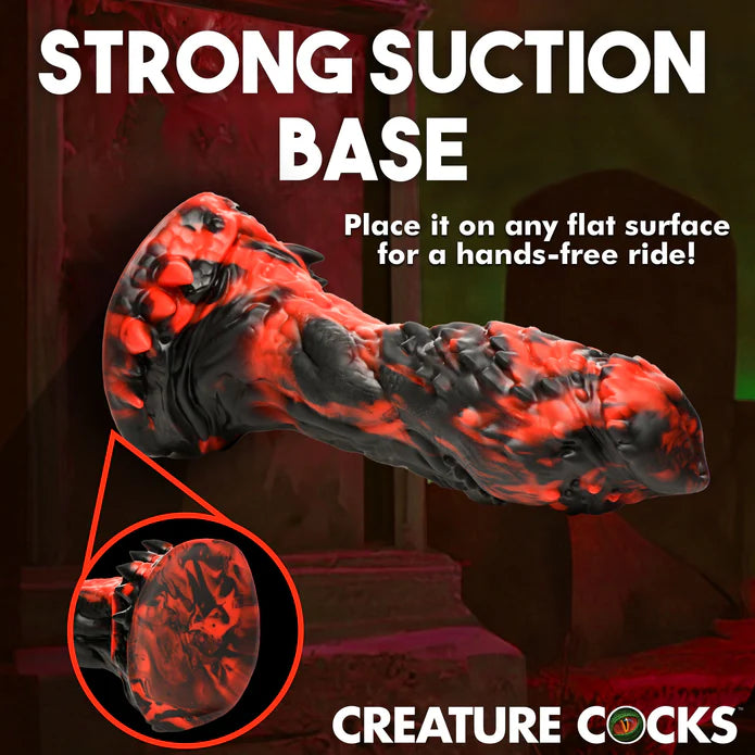 The Creature Cocks Reaper shown adhered onto a flat vertical surface. Text on the image reads: "Strong suction base. Place it on any flat surface for a hands-free ride" | Kinkly Shop