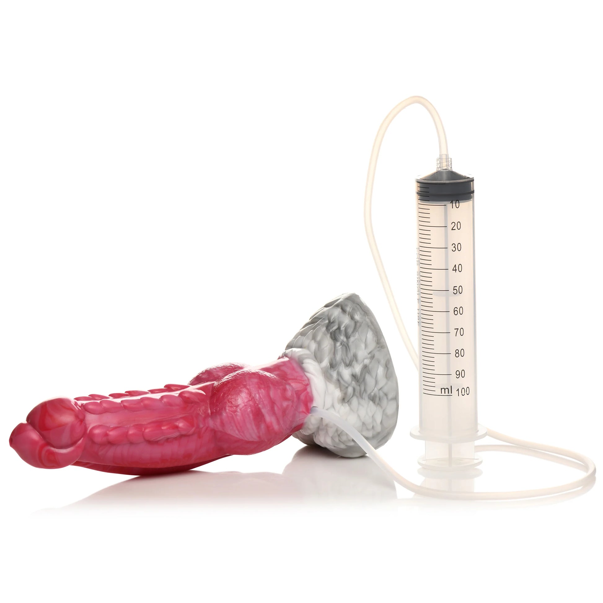 The Creature Cocks Resurrector Phoenix Squirting shown next to the attached tubing and syringe that allows the dildo to ejaculate. | Kinkly Shop