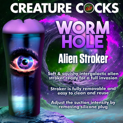 The Creature Cocks Wormhole Alien in front of a galaxy style background with lots of text on the image. Text on the image includes: Worm hole alien stroker. Soft and squishy intergalactic alien stroker ready for a full invasion. Stroker is fully removable and easy to clean and reuse. Adjust the suction intensity by removing the silicone plug." | Kinkly Shop
