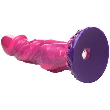 Close-up on the base of the Creature Cocks Xenox Vibrating Remote-Controlled Dildo. There's a hole in the base where the vibrator is inserted into the dildo's center to provide the vibrations. | Kinkly Shop