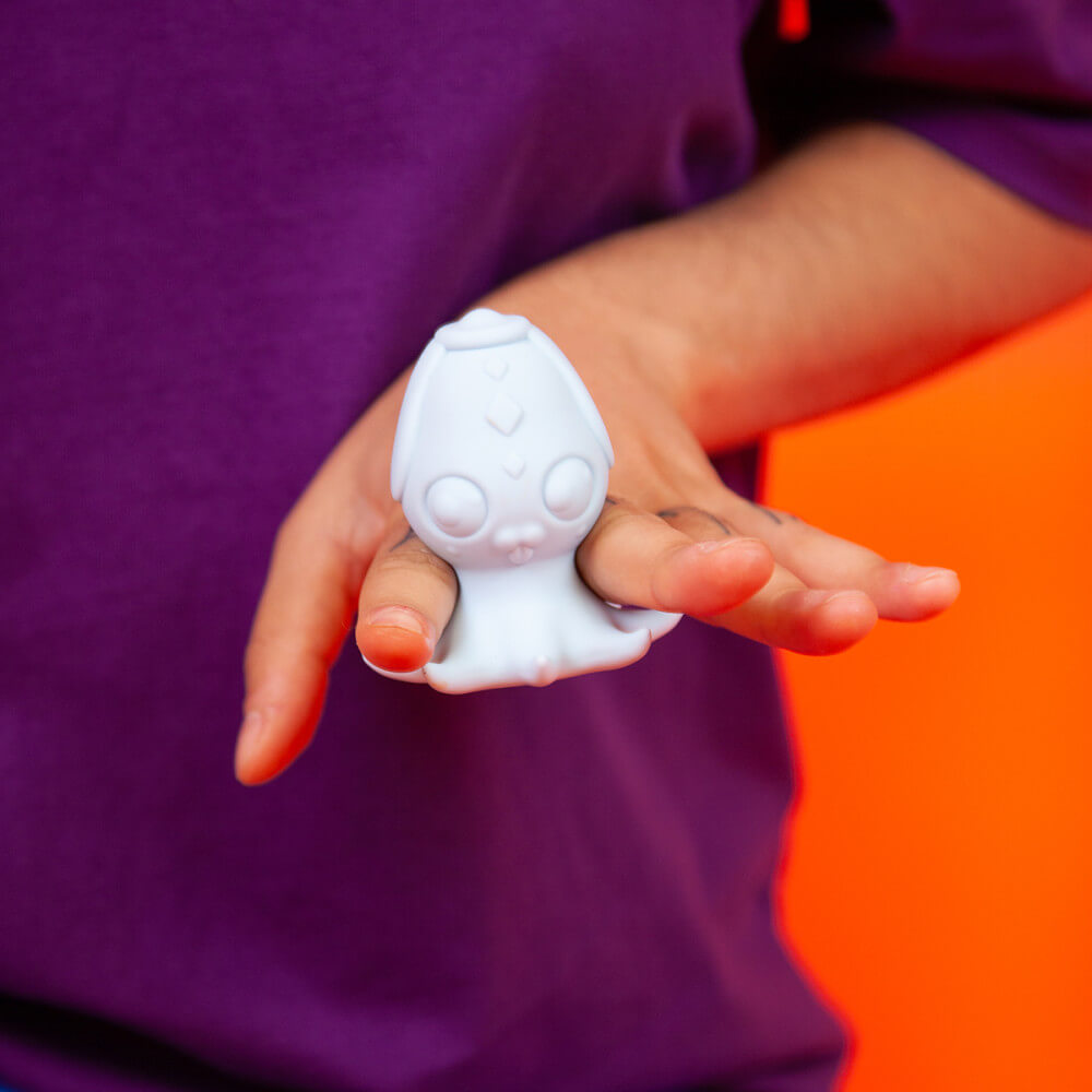 The Cute Little Fuckers Princette Puppypus slid in-between a person's pointer and middle finger. The size of the retention area of the toy perfectly fits between the fingers and allows for "finger free" holding of the sex toy when snuggled into this spot. | Kinkly Shop