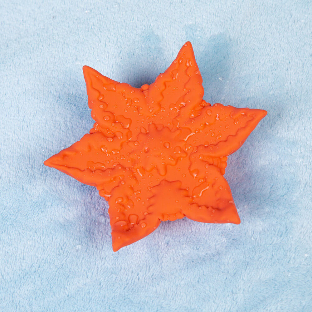 The Cute Little Fuckers Starsi laying on top of a soft blue towel, covered in water droplets. It is waterproof. | Kinkly Shop
