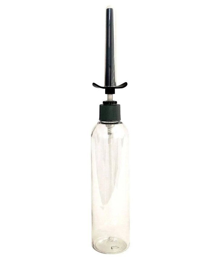 The Demon Kat Spout Lube Shooter screwed onto the top of an empty, clear, see-through bottle to showcase how the lube shooter works. | Kinkly Shop