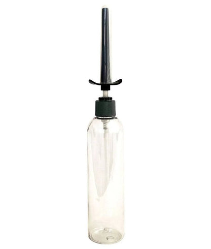 The Demon Kat Spout Lube Shooter screwed onto the top of an empty, clear, see-through bottle to showcase how the lube shooter works. | Kinkly Shop