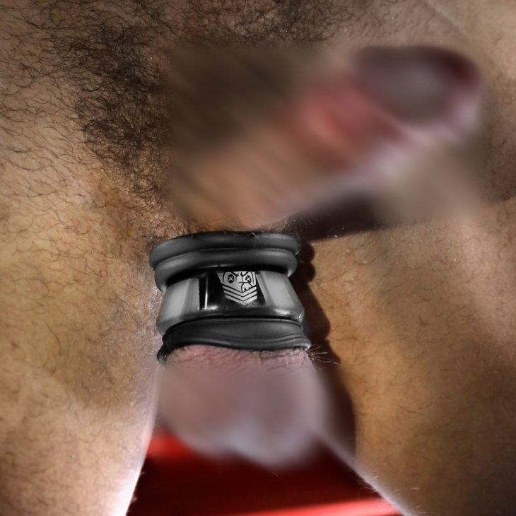 A realistic image with blurred bits showcasing the Fort Troff Full Metal Jacket worn on the testicles. It pulls them downwards. | Kinkly Shop