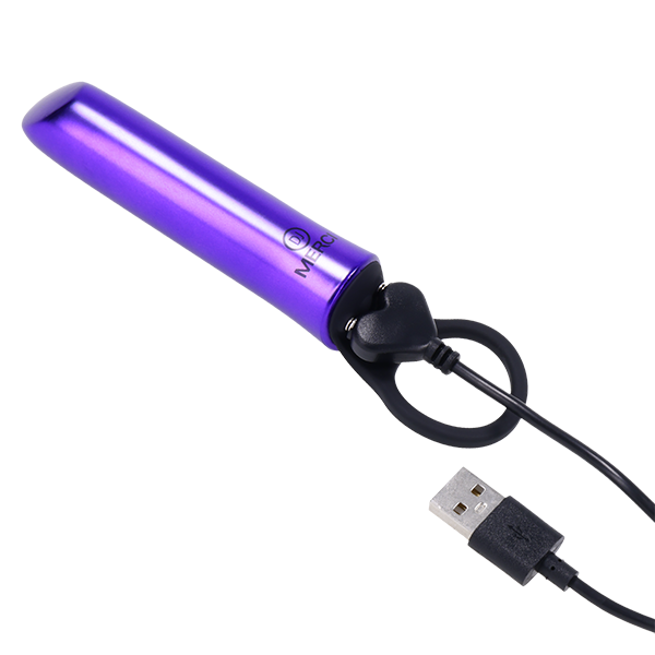The charging cable shown plugged into the base of the Merci Power Play. The charging cable is a magnetic cable. | Kinkly