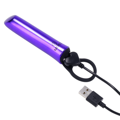 The charging cable shown plugged into the base of the Merci Power Play. The charging cable is a magnetic cable. | Kinkly