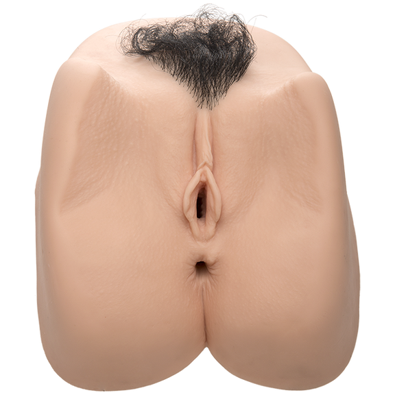 The Sasha Grey Vibrating Deep Penetration penis stroker. The square-shaped stroker has a vulva and anal entrance. It also has a triangle-shaped tuft of pubic hair. | Kinkly Shop