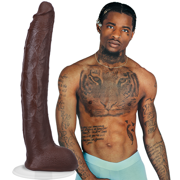 A shirtless Damion Dayski wearing boxer briefs. Their Signature Cocks - Damion Dayski dildo is shown next to the porn star. The dildo is lifecast from the model themselves. | Kinkly Shop