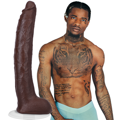 A shirtless Damion Dayski wearing boxer briefs. Their Signature Cocks - Damion Dayski dildo is shown next to the porn star. The dildo is lifecast from the model themselves. | Kinkly Shop