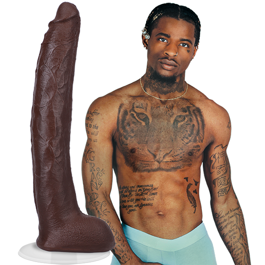 A shirtless Damion Dayski wearing boxer briefs. Their Signature Cocks - Damion Dayski dildo is shown next to the porn star. The dildo is lifecast from the model themselves. | Kinkly Shop