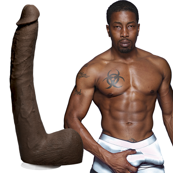 Isiah Maxwell is shirtless and staring into the camera while grabbing his bulge in his boxer briefs. The Signature Cocks - Isiah Maxwell dildo is shown next to the porn star. | Kinkly Shop