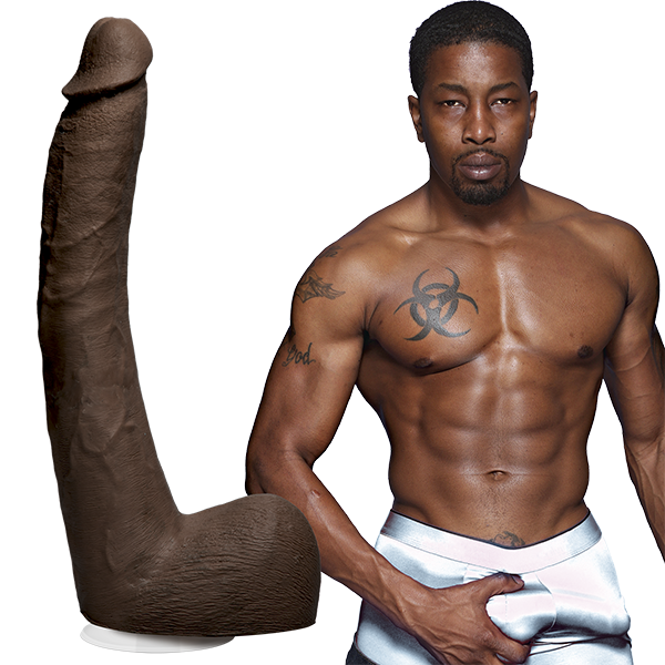 Isiah Maxwell is shirtless and staring into the camera while grabbing his bulge in his boxer briefs. The Signature Cocks - Isiah Maxwell dildo is shown next to the porn star. | Kinkly Shop