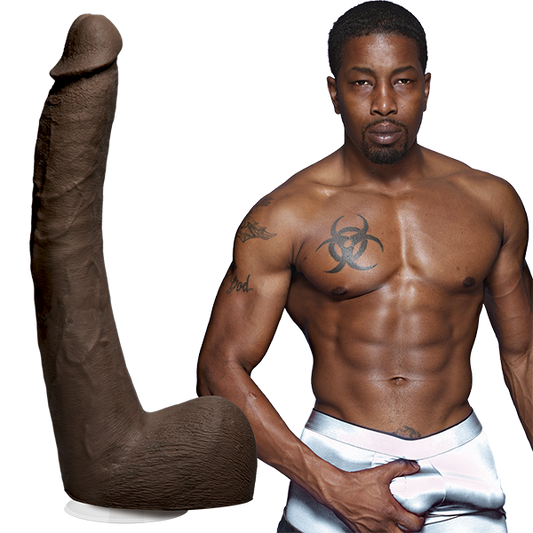 Isiah Maxwell is shirtless and staring into the camera while grabbing his bulge in his boxer briefs. The Signature Cocks - Isiah Maxwell dildo is shown next to the porn star. | Kinkly Shop