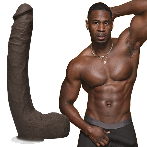 A shirtless Jax Slayher stares into the camera while grabbing the bulge in his boxer briefs. The Signature Cocks - Jax Slayher dildo is shown next to the porn star's body. | Kinkly Shop