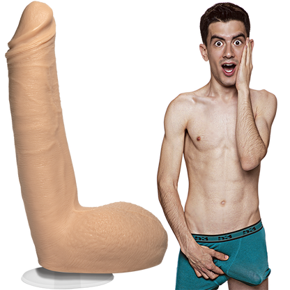 A shirtless Jordi El Nina Polla is wearing his boxer briefs with an erection. The Signature Cocks - Jordi El Nina Polla dildo is sitting out next to him, showcasing the lifecast dildo. | Kinkly Shop