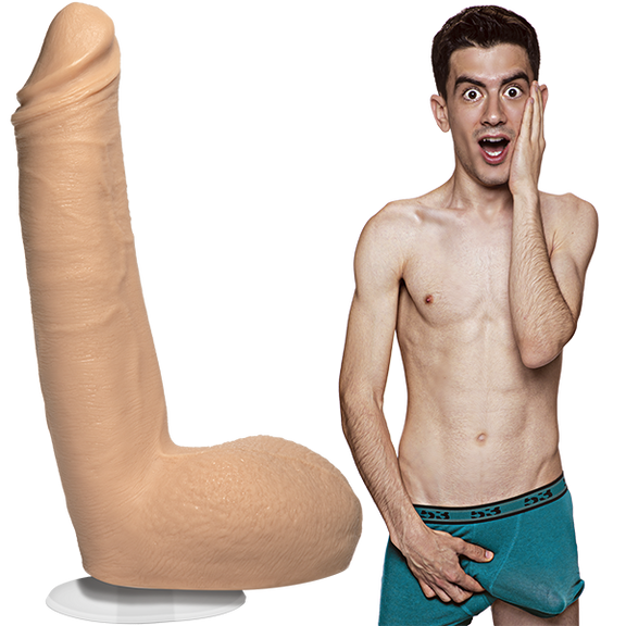 A shirtless Jordi El Nina Polla is wearing his boxer briefs with an erection. The Signature Cocks - Jordi El Nina Polla dildo is sitting out next to him, showcasing the lifecast dildo. | Kinkly Shop