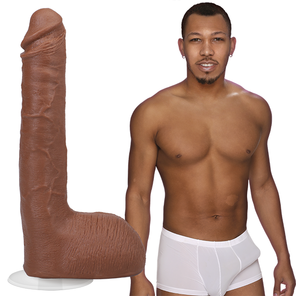 Ricky Johnson is shirtless with an erection in his underwear, standing next to the Signature Cocks - Ricky Johnson dildo, lifecast directly from his own shaft. | Kinkly Shop